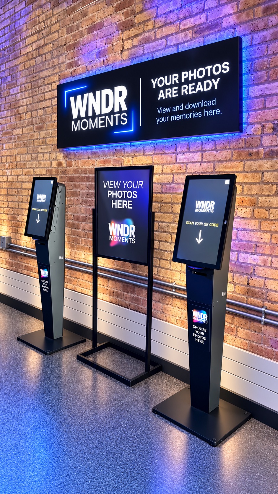 Illustrative WNDR Moments sales stations with touchscreens and branded signage